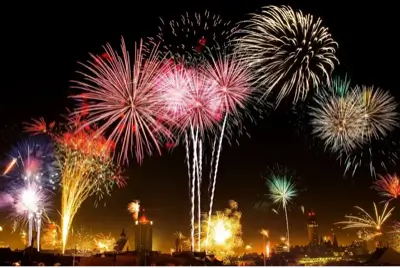 fireworks above a city skyline