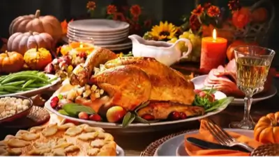 a thanksgiving dinner table with a turkey